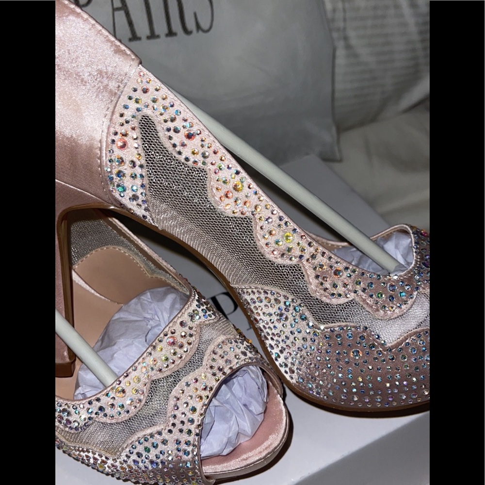 Champagne heels .size 8.5. Comes with inserts and covers for each- never worn